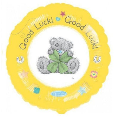 18″ Licensed Tatty Ted Good Luck Foil Balloon, a round yellow balloon featuring a gray teddy bear holding a four-leaf clover, with the text Good Luck! and horseshoe icons.