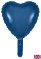 A shiny, unprinted navy blue heart-shaped foil balloon from Oaktree, 9" with a small tail and self-sealing valve. UK flag in the bottom right corner. Airfill only; comes in packs of 5.