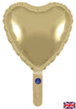 A 9" gold silk heart-shaped foil balloon with a handle, featuring a self-sealing valve and air-fill only design by Oaktree. Displayed against a white background with a small UK flag in the lower-right corner.