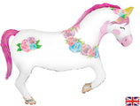 The 35" Oaktree Brand Unicorn Flower Horse Foil Balloon features a shiny unicorn with a pink and purple mane, gold horn, floral accents, and peaceful closed eyes. A small UK flag is displayed in the bottom right corner.
