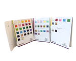 Color swatch book with various color samples on a white background