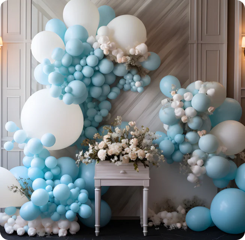 a wedding display of baby blue and white balloons with white roses