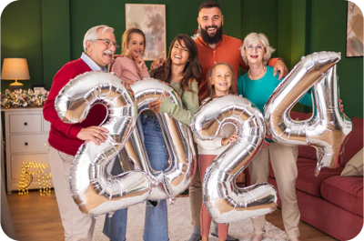 Three generations of family members holding up the numbers 2024